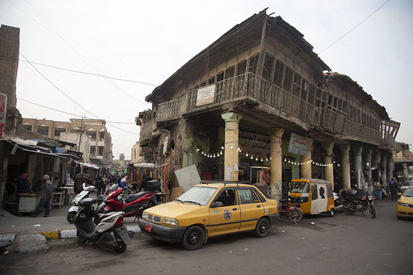 Taxis and one of the dilapidated buildings on Rashid Street | Baghdad impressions | Iraq