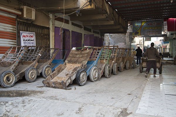 Rows of carts waiting to be filled and pushed at the market of Basra | Basra impressions | Iraq