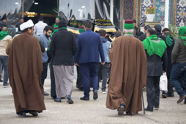 Men carrying a casket into the shrine of Al-Abbas | Karbala holy shrines | Iraq