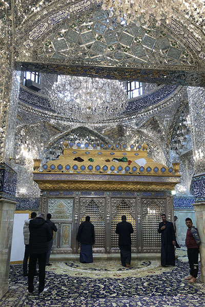 Foto van Men at a heavily decorated shrine inside the Great Mosque of KufaKufa - Irak