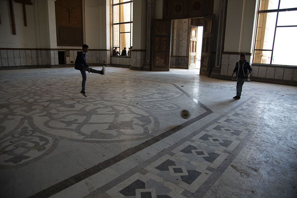 Picture of Kids playing football in one of the halls of the palace of SaddamBabylon - Iraq