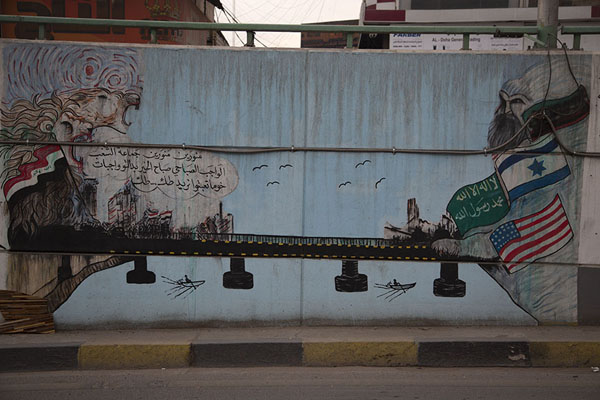Foto van Mural drawing attention to foreign forces active in IraqBagdad - Irak