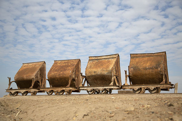 Some carriages on a train track, once used for excavations | Uruk | Iraq