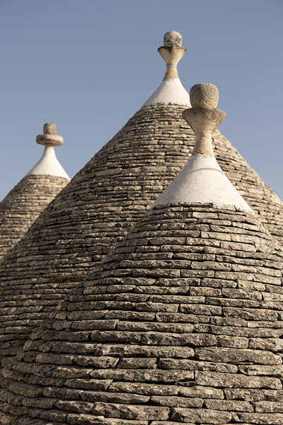 Foto van Close-up of pointed roofs of trulli in AlberobelloAlberobello - Italië