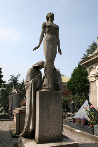 Woman towering high above tomb in Cimitero Monumentale | Cimetière monumental | l'Italie