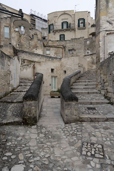 Stone street in the Sassi area of Matera with stone houses | Matera | Italië