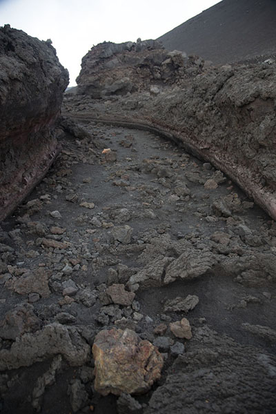 A lava stream created this channel on the slopes of Mount Etna | Mount Etna summit hike | Italy