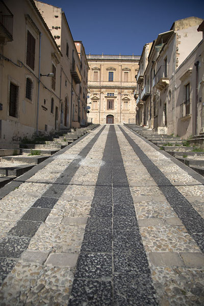 Picture of Noto (Italy): Palazzo Ducezio appearing at the end of a street in Noto