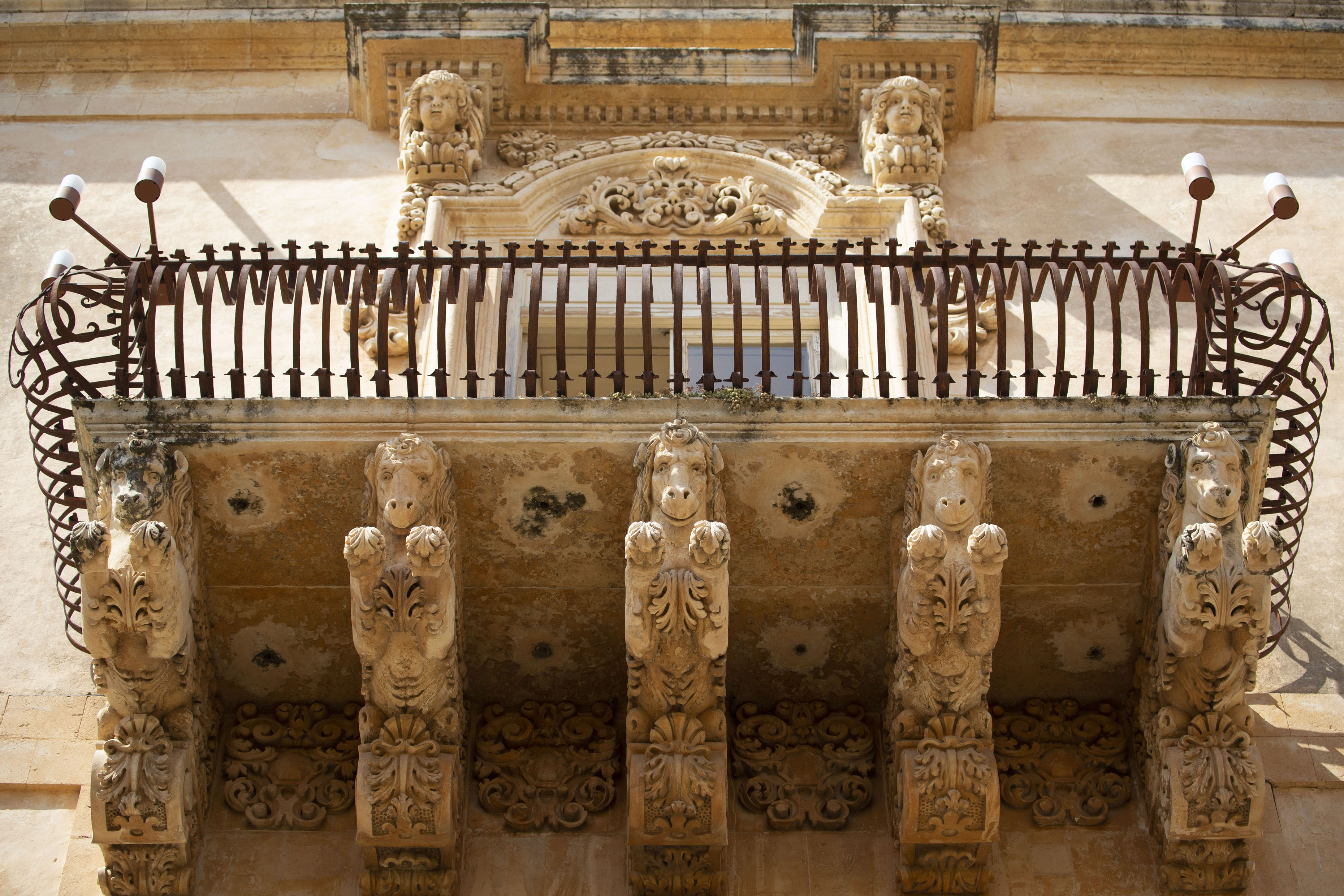 Picture of Close-up of a balcony with galloping horses of the Palazzo Nicolaci di VilladorataNoto - Italy