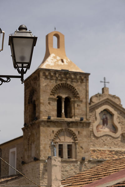 Picture of The Church of the Blessed Virgin of the Assumption behind a street lantern in Rocca Imperiale - Italy - Europe