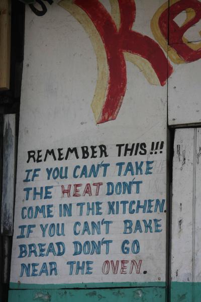A free piece of wisdom on the wall of a shop | Kingston Market | Jamaica