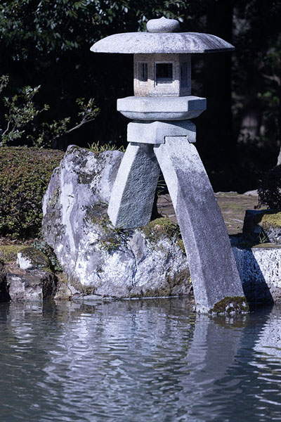 The two-legged Kotoji stone lantern is one of the landmarks of Kenrokuen garden | Kenrokuen | Japan