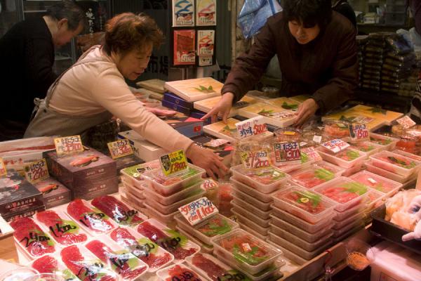 Picture of Tsukiji Central Fish Market (Japan): Buying fresh fish at a stall near Tsukiji market