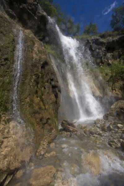 Picture of View of the small waterfall with rainbow seen from the bottom