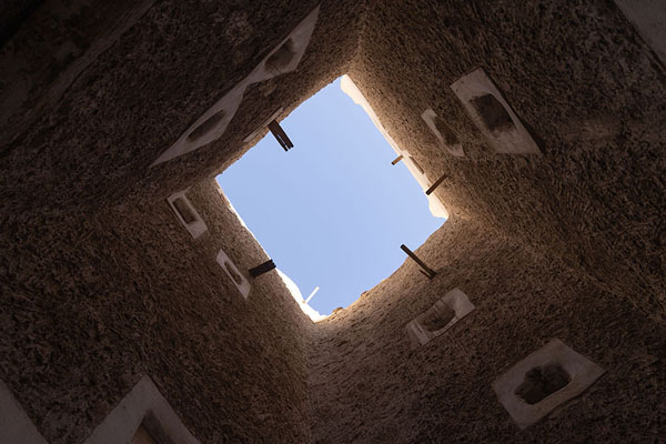 Looking up one of the many skylights in a street in the old city of Ghadames | Ghadames | Libië