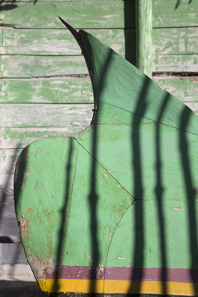 Picture of Andavadoaka (Madagascar): Detail of pirogue next to a wooden house in Andavadoaka