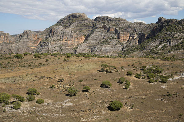 Picture of Isalo National Park (Madagascar): Panorama with a plain with trees and rocky mountains