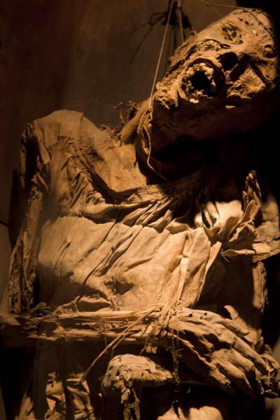 China girl in a casket in the museum with threads holding up her head | Mummies Museum | Messico