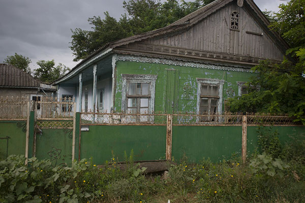 Picture of Congaz (Moldova): Looking over the fence, you can see beautiful traditional houses with a porch in Congaz