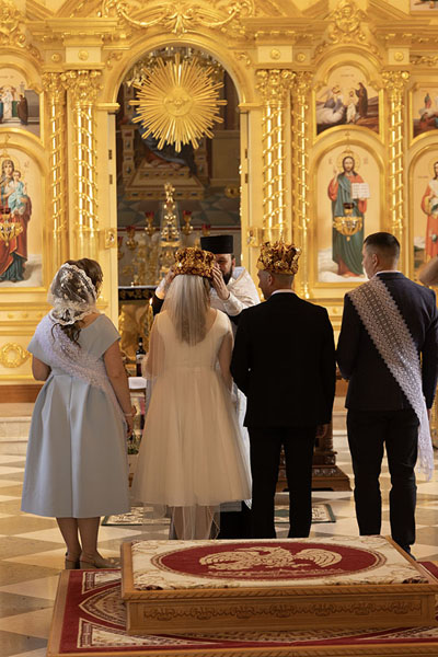Picture of Curchi monastery (Moldova): Couple receiving crowns during a ceremony in Naşterea Domnului church in Curchi monastery