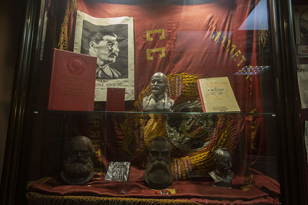 Close-up of memorabilia of Soviet times with a picture of Stalin, and bustes of Lenin and Marx | National Museum of History of Moldova | Moldova