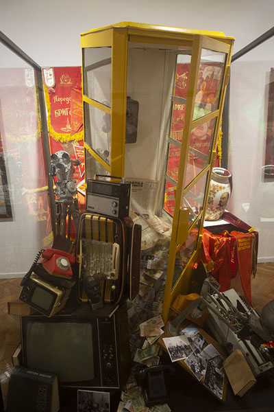 Picture of Phone booth with other old objects, and a vase with LeninChisinau - Moldova
