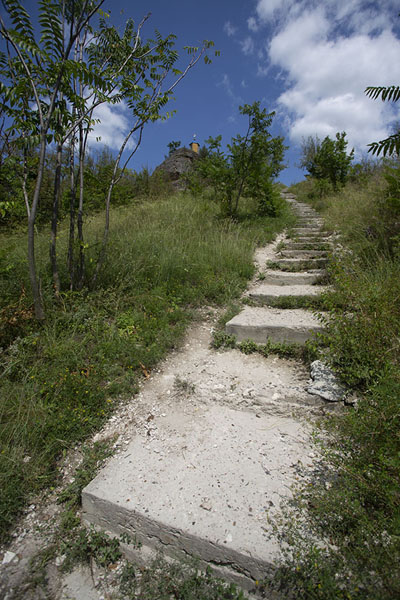 Path with steps leading up the rocky outcrop above Saharna Monastery | Saharna monastery | Moldova