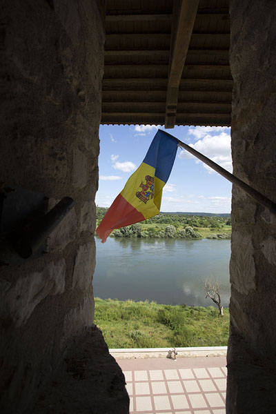 Foto di View towards Ukraine across the Dniester river with the Moldovan flagSoroca - Moldavia