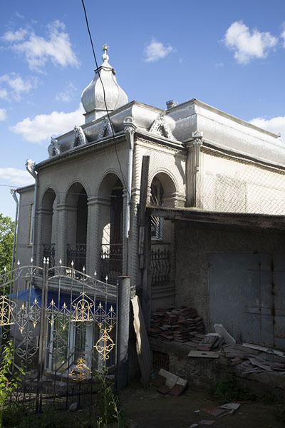Mansion behind a gate where construction still is going on | Soroca Gypsy mansions | Moldova
