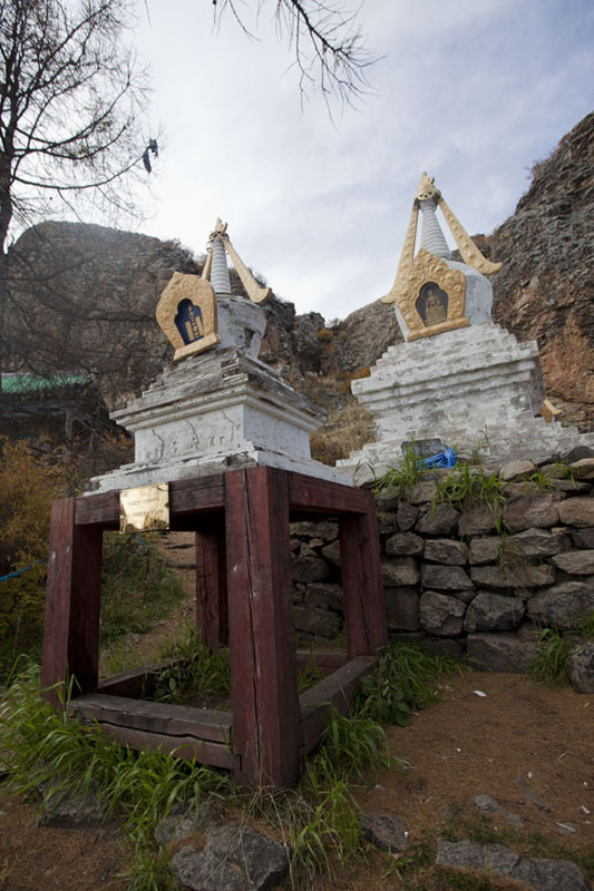 Picture of White stupas and rock formation in the back