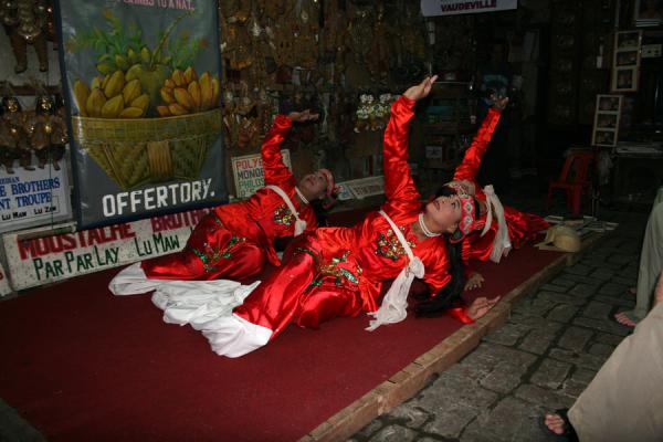 Picture of Three women performing in Burmese traditional dress for the Moustache Brothers