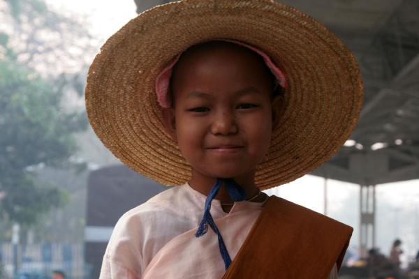 Picture of Young Burmese nun posing for a picture at Naba railway station - Myanmar - Asia