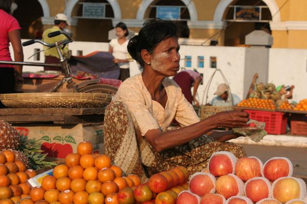 Picture of Marketwoman selling fruit at the evening market of Pathein