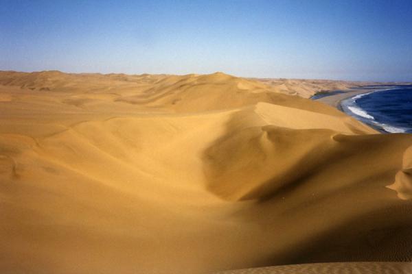 Picture of Sandwich Harbour (Namibia): Sand dunes and desert with the ocean on the right