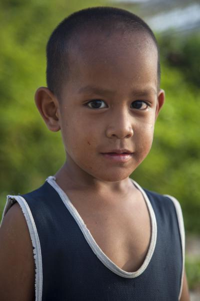 Picture of Young Nauruan boy at the beach near the cantilevers in Aiwo