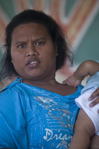 Picture of Nauruan woman with baby on her arm