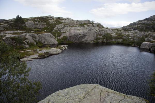 Picture of Small lake surrounded by rocks on the hike to Preikestolen