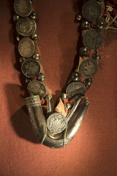 Picture of Close-up of Omani jewellery with old coinsMuscat - Oman