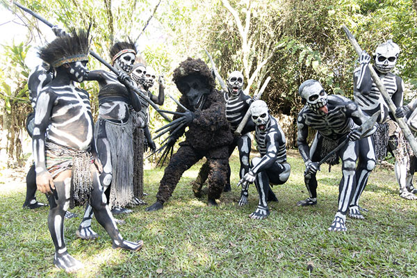 The skeleton men and the monster posing for a picture after their performance | Skeleton Men | Papua Nuova Guinea