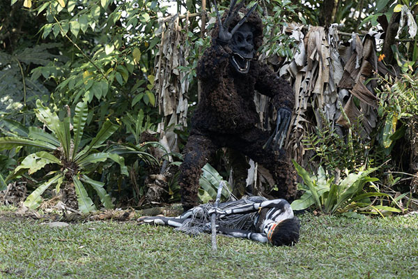 Picture of The monster has thrown a skeleton woman on the groundSkeleton Men - Papua New Guinea