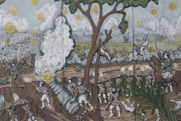 Foto di Mural depicting a battle in the War of the Triple Alliance on the main street of PilarPilar - Paraguay