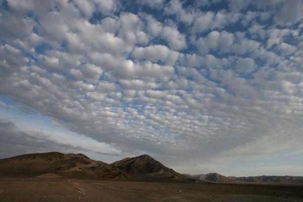 Picture of Chauchilla cemetery (Peru): Chauchilla landscape with hills and clouds