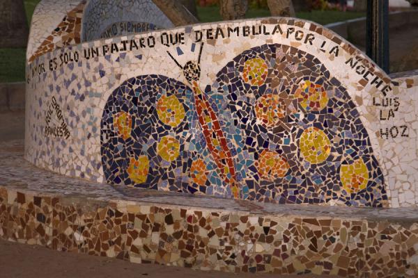 Picture of Colourful butterfly with statement in a bench in the Parque del Amor