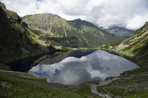 Picture of Mountains and clouds reflected in Czarny Staw pod RysamiMount Rysy - Poland