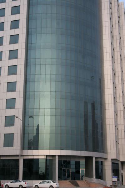 Foto di Reflection of modern glass and concrete building in DohaDoha - Qatar