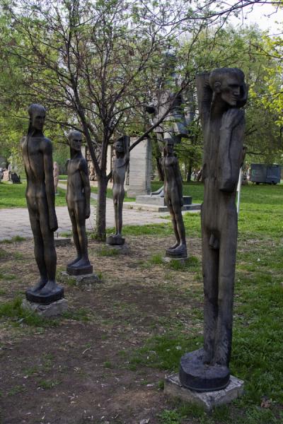 Wooden statues of naked men in the Sculpture Park | Parque de las estatuas | Rusia
