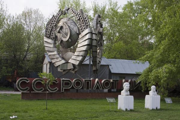 Busts of Lenin and Stalin in front of a Soviet-era communist monument | Sculpture Park | Russia