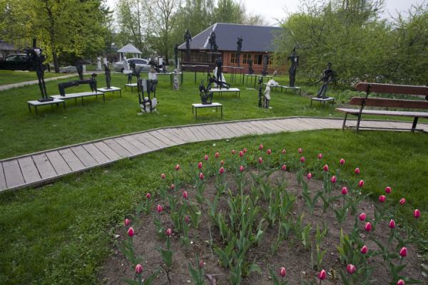 Picture of Sculpture Park (Russia): Flowerbed with tulips and a group of works of art in the Sculpture Park