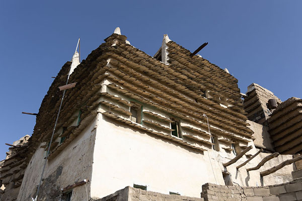Picture of Looking up one of the traditional houses in Al Basta district, with clearly visible slatesAbha - Saudi Arabia