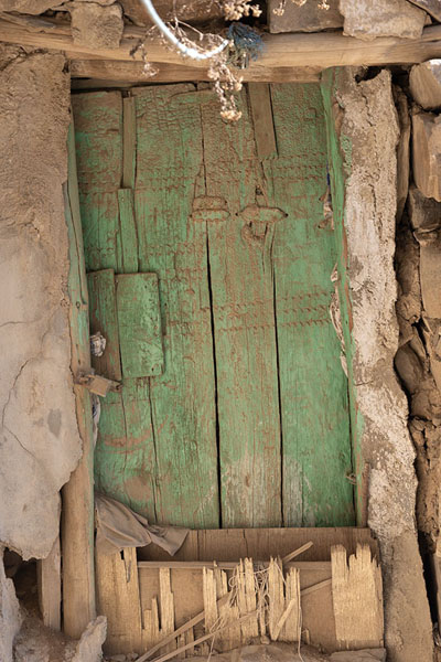 Picture of Abha old houses (Saudi Arabia): Wooden door painted green in Al Basta district in Abha